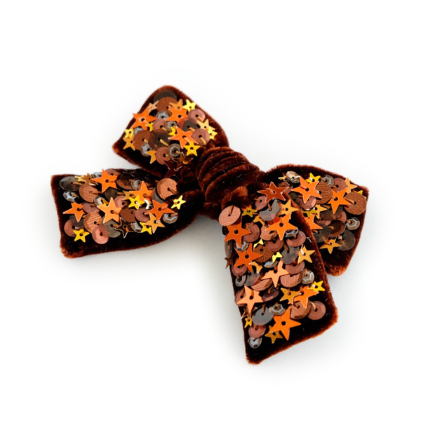 Pumpkin Spice colored hair bow made from dazzling velvet and embellished with sparkly sequin.