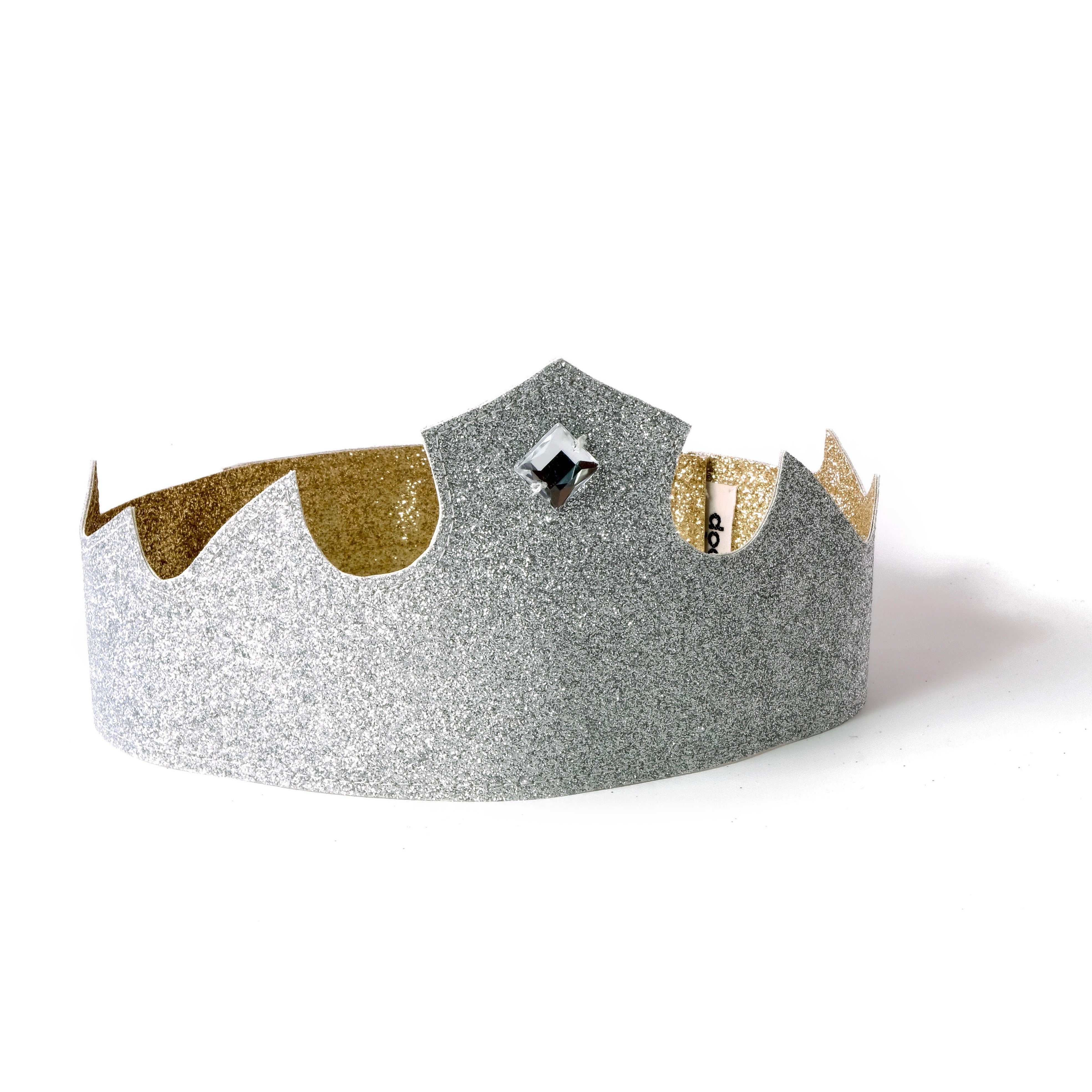 Reversible pretend-play crown by doodlelidoo.  It fits all with it's adjustable Velcro  closure  and  comes in gold color on one side and silver on the other with a gem in  the center.