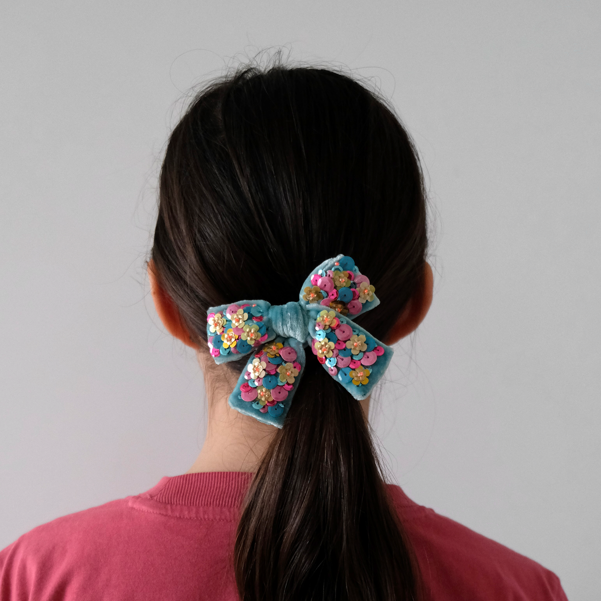 This sequins embellished turquoise silk velvet bow looks fabulous attached to a pony tail!  