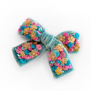 This gorgeous turquoise colored silk velvet hair bow is embellished with couture sequin and glass beads.