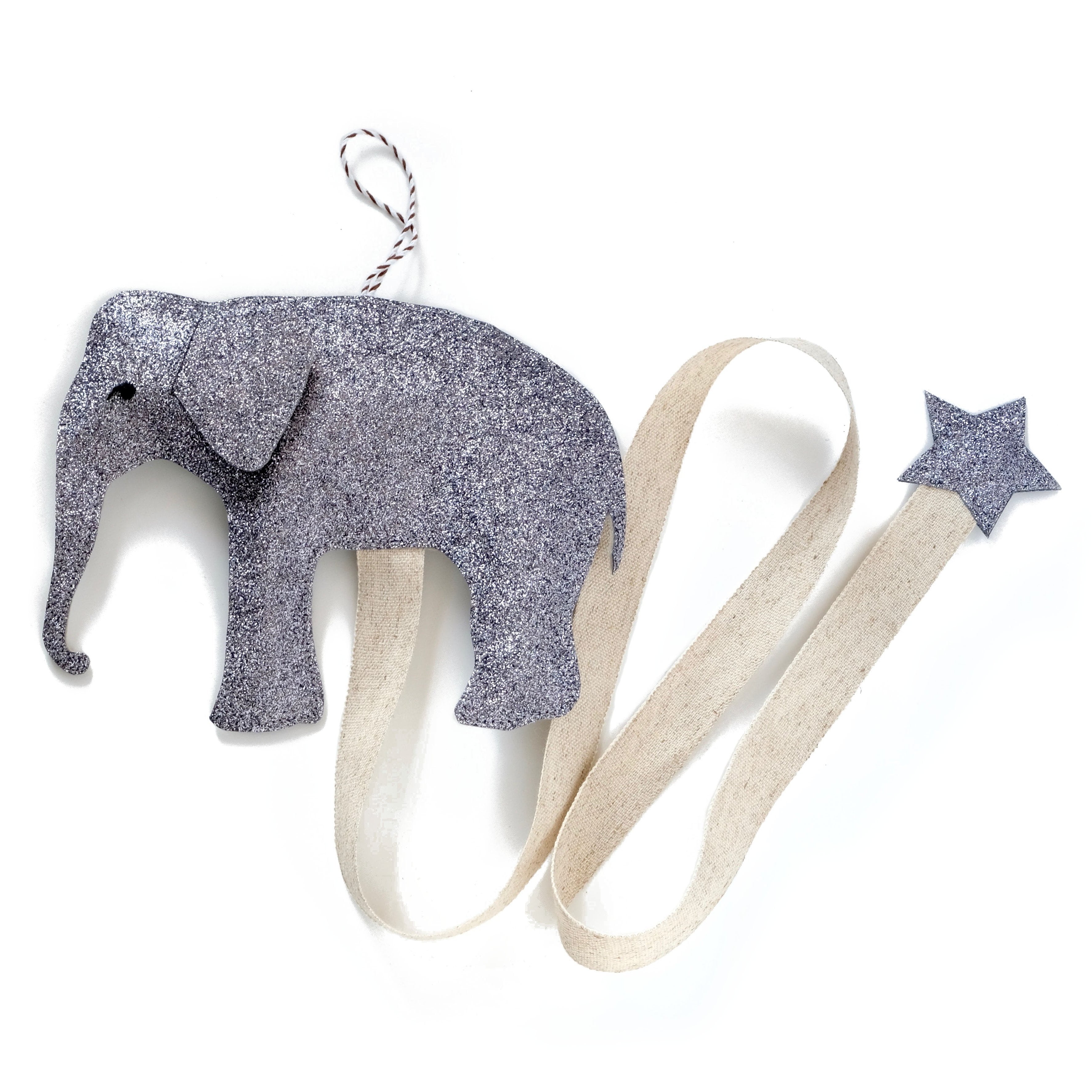 A children's room decoration on like any other, a wall mountable hair clip holder in the shape of an elephant.  Available in dark grey, silver or gold.