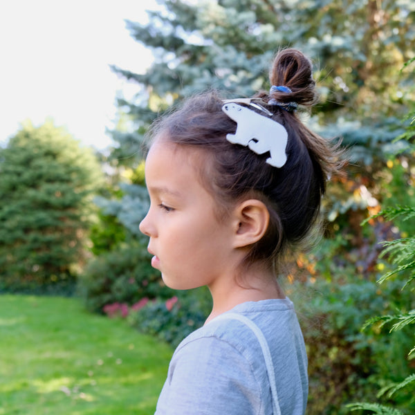 Model with polar bear hair clip.