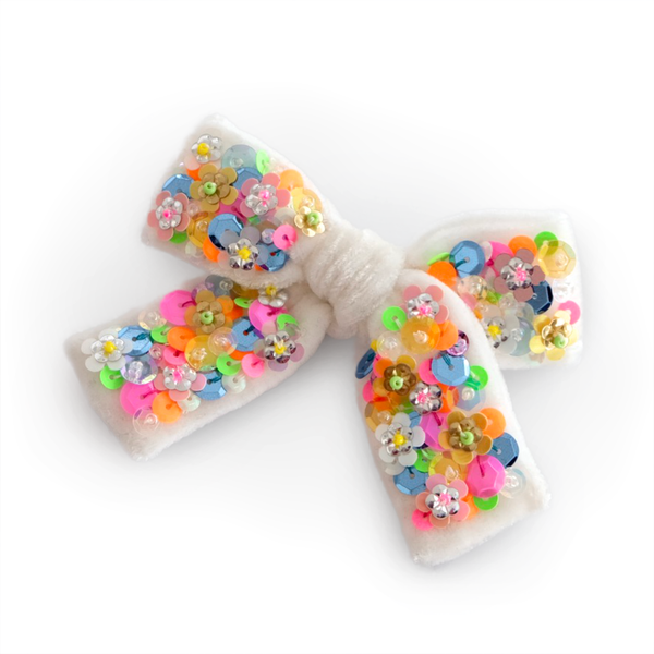 You'll want to dance to 80ies songs with our neon sequin velvet hair bow.