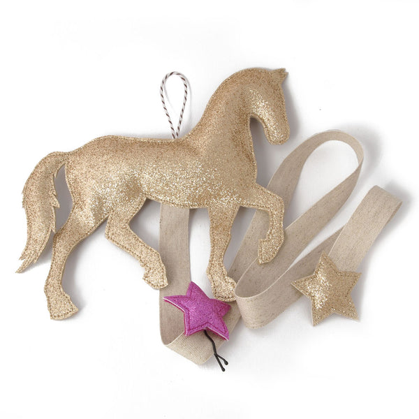 A hair clip holder in the shape of a pony.  Comes in silver or gold glitter cotton fabric.