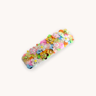 Large hair clip embellished with  flower sequin in neon colors.
