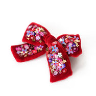 Red velvet hair bow with sequin.