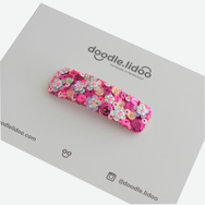 Fun, sparkly hair clip embellished with sequin .  Available in three sizes.