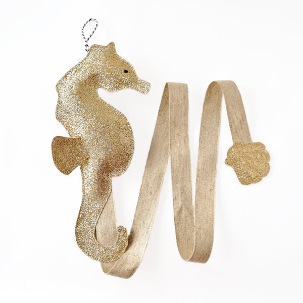 This handmade hair accessories  holder in the shape of seahorse is both stylish and functional.  Available gold, silver or blue color.