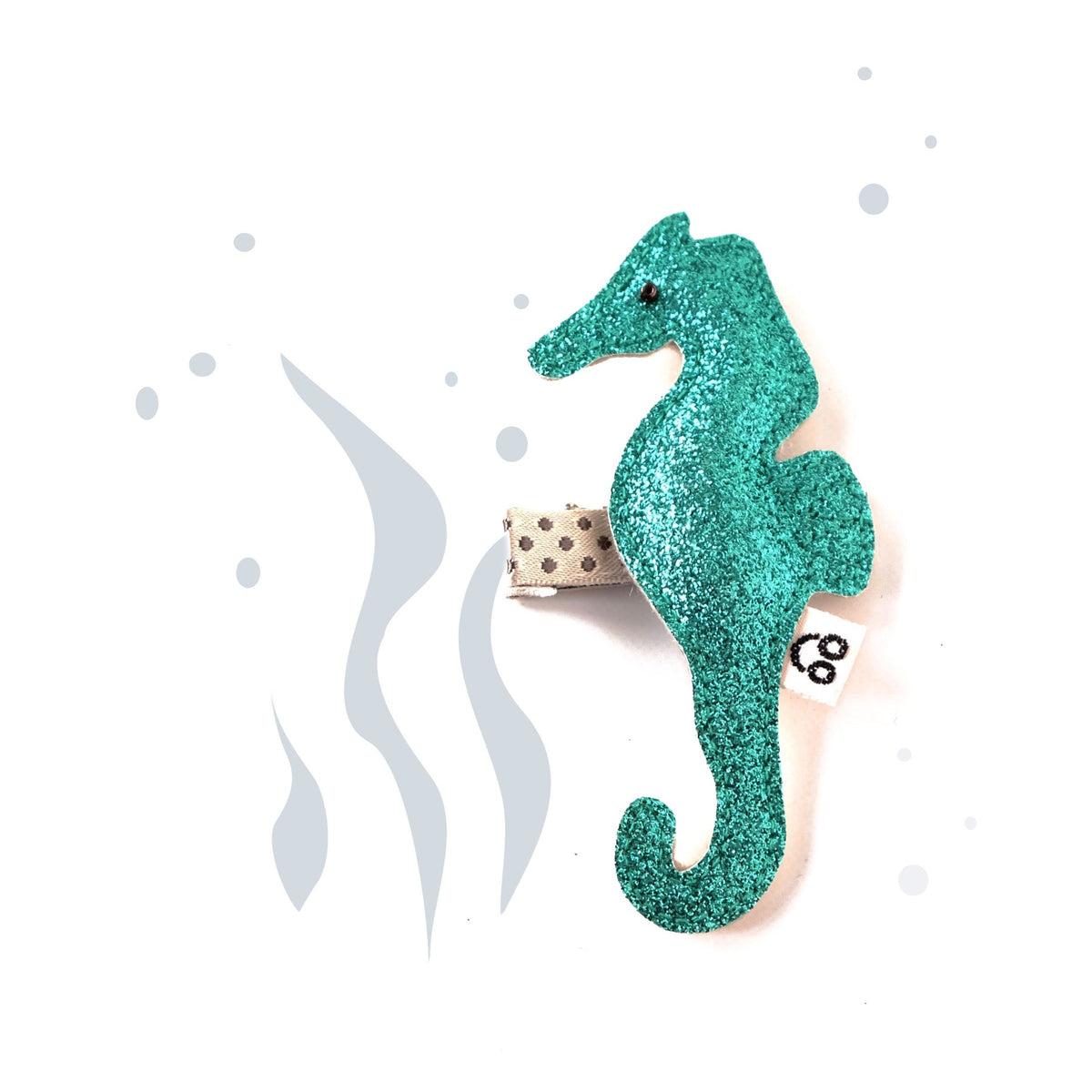 The perfect hair accessory, a sparkly seahorse hair clip, available in gold, silver, blue, or green.
