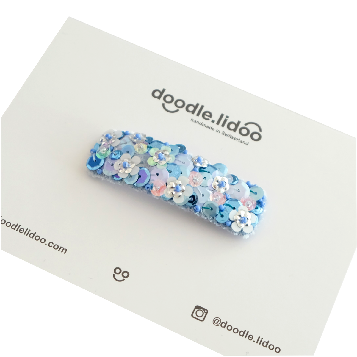 Retro hair clip in sky blue embellished with sequins.