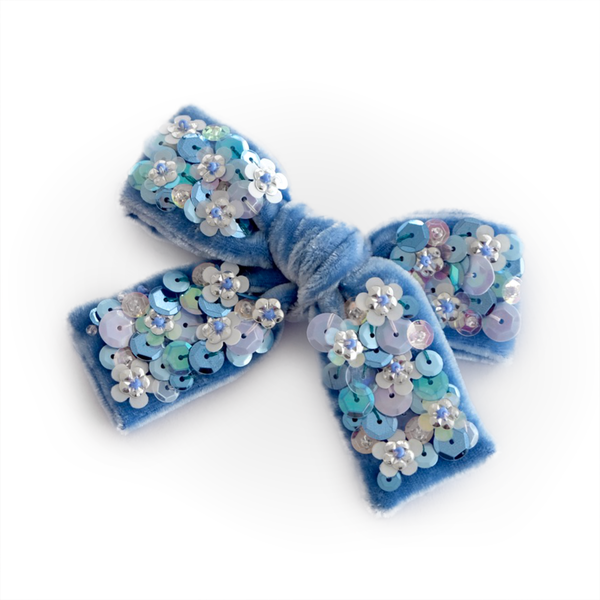 Sky blue silk velvet hair bow embellished with sparkly sequin in shape of flowers.