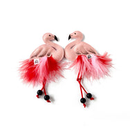 A special pink flamingo hair clip with dancing feathers and dangling legs.  