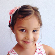 Our pink flaming hair clip will place a big smile on your little one's face.