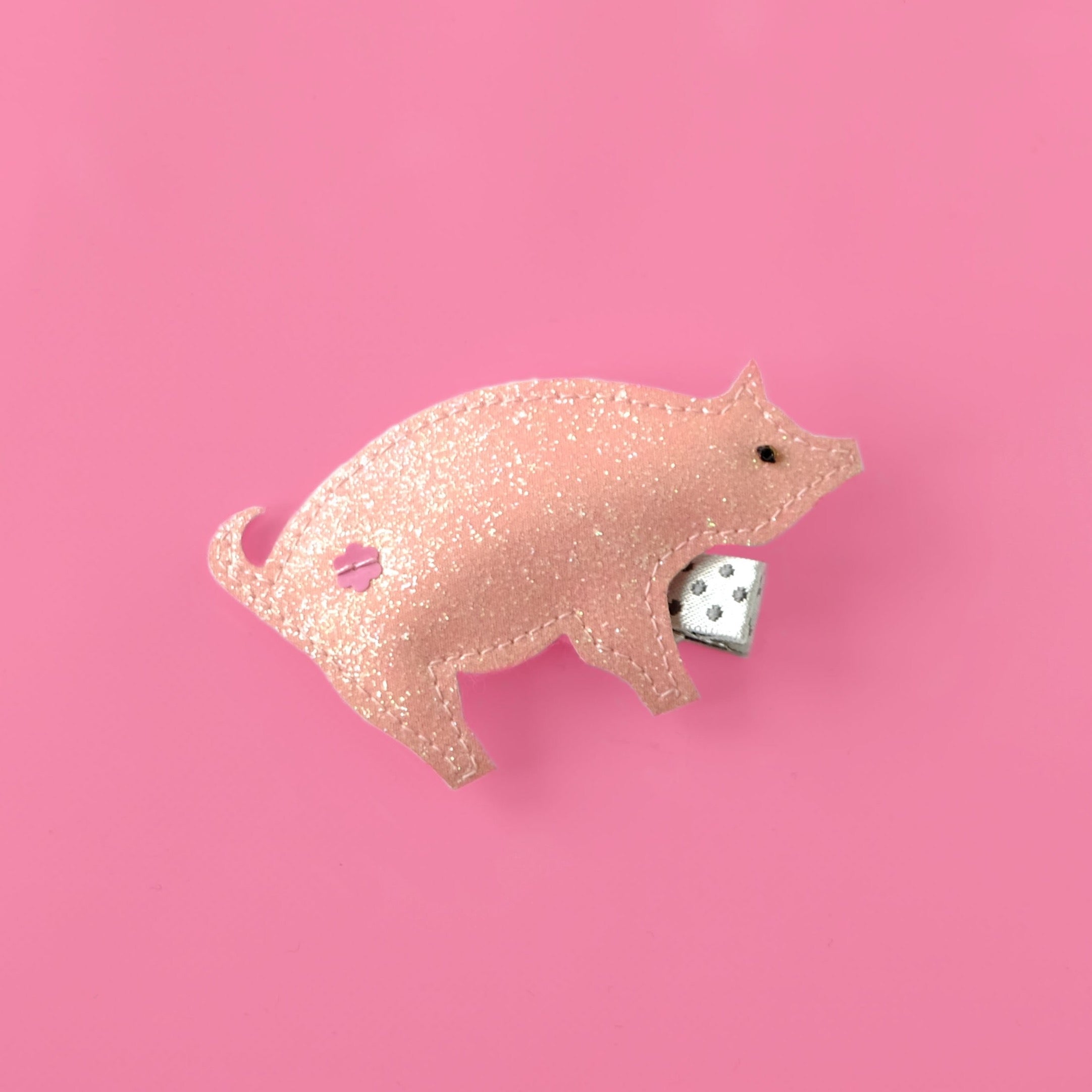 Pink pig hair clip, a fun hair accessory for all little farm animal lovers.