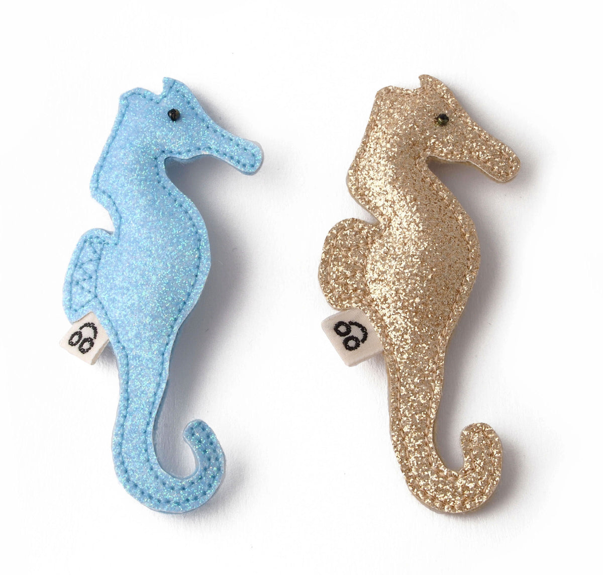 A fun hair clip in the shape of a seahorse for all the little beach goers.  Available in multiple color options.