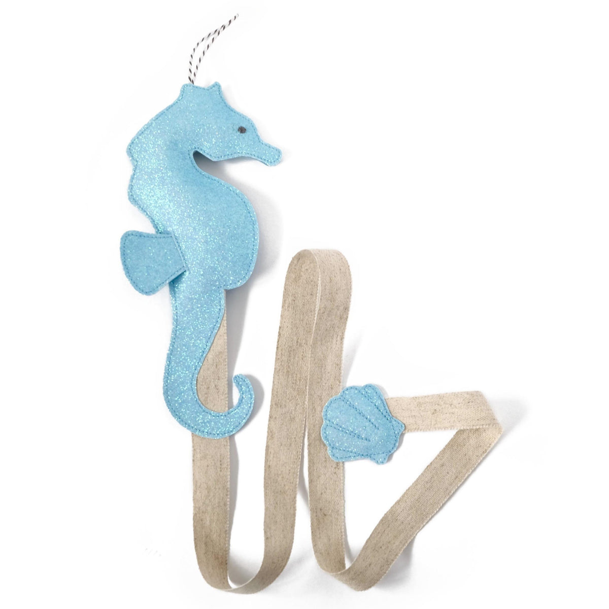 Stylish and functional hair clip holder in the shape of a seahorse.  Available in blue, gold or silver color.