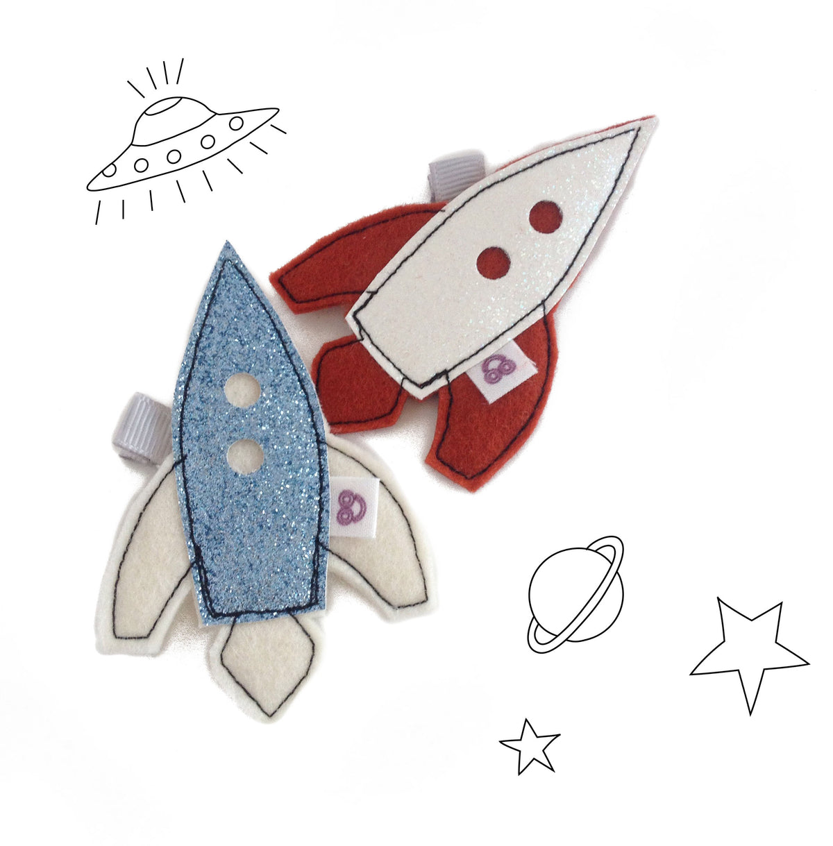 These adorable space ship hair clips are a long time staple in our store.  Adored by little explorers for many years.